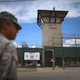 A military officer stands near the entrance to Camp VI at the U.S. military prison for “enemy combatants” on June 25, 2013, in Guantanamo Bay, Cuba.
Joe Raedle/Getty Images